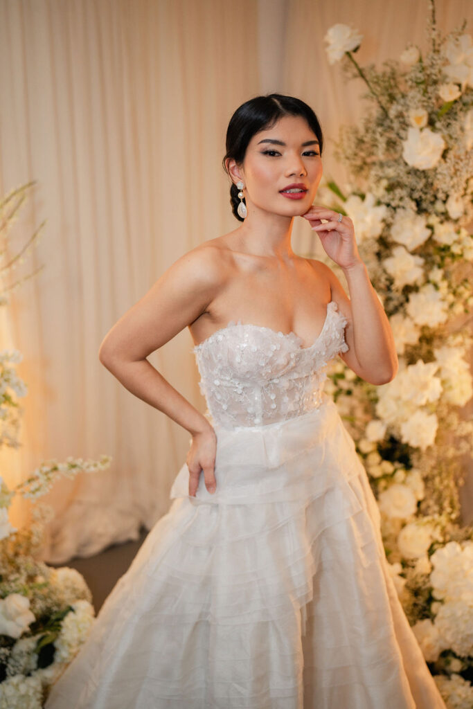 Asian model wearing strapless wedding gown